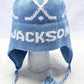 EARFLAP HAT WITH DESIGN AND POMPOM